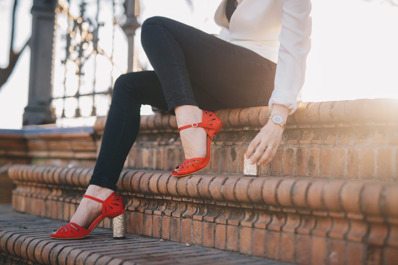 Carrie — red sandal on golden steps